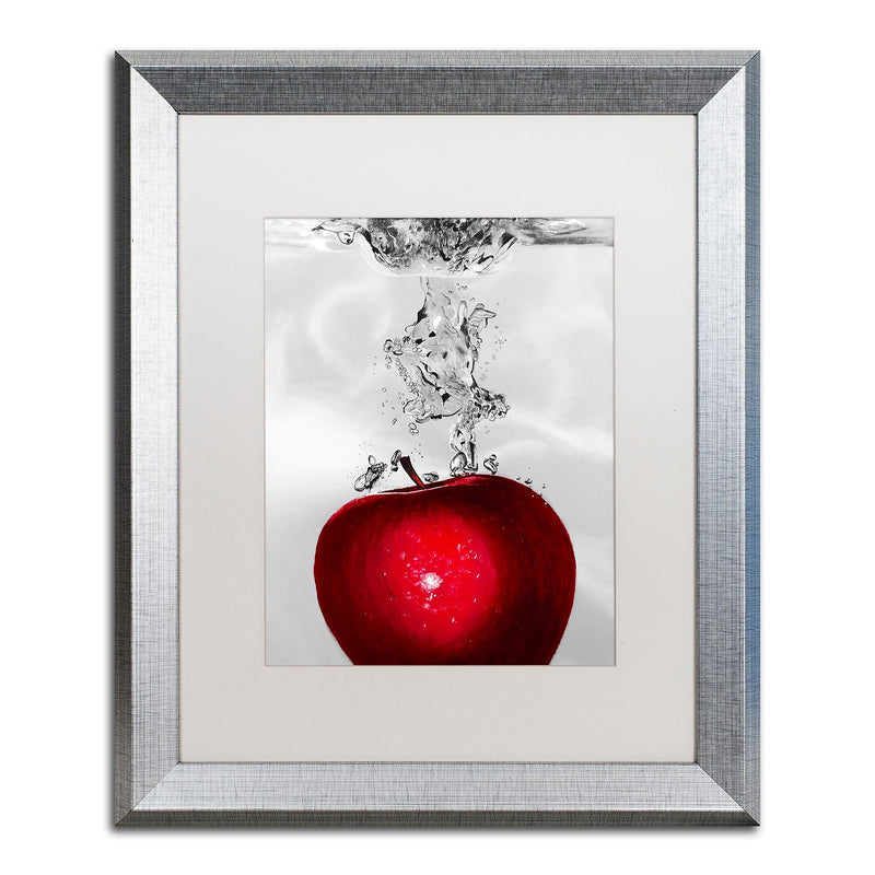 Trademark Fine Art ''Red Apple Splash'' by Roderick Stevens 16" x 20" White Matted Silver Frame (RS012-S1620MF)