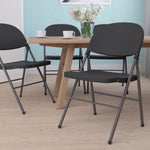 Flash Furniture HERCULES™ Plastic Armless Folding Chair With Charcoal Frame, Black, 4/Pack